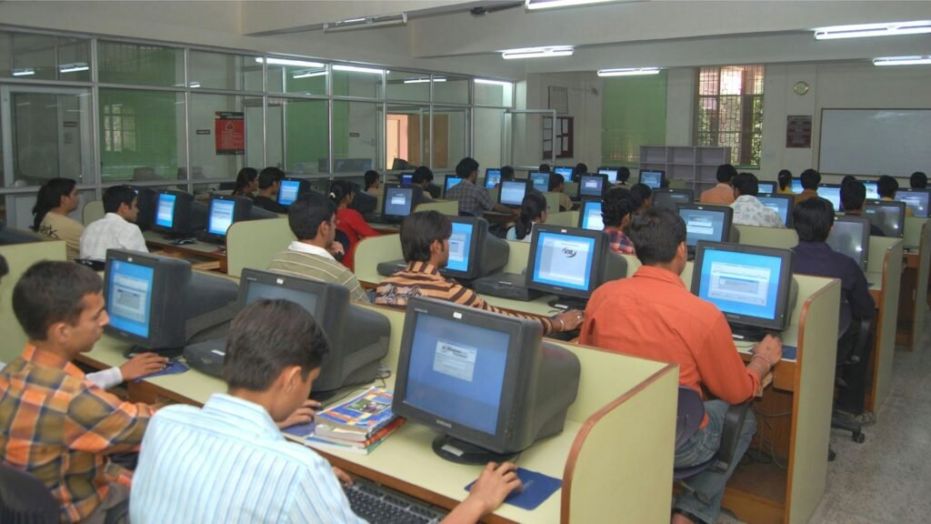 Students practising in a computer training lab