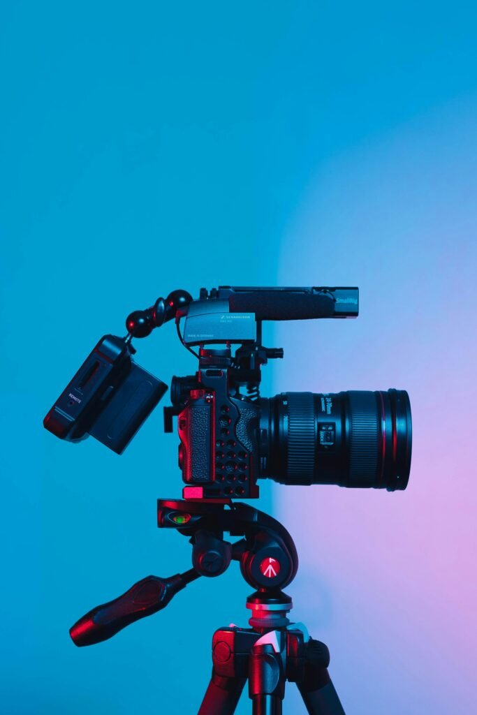 Professional video camera with microphone on a tripod